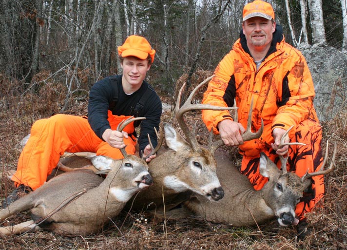 Doc's son Ken, grandson Ryan with Ken's 3 2012 8-pointers.